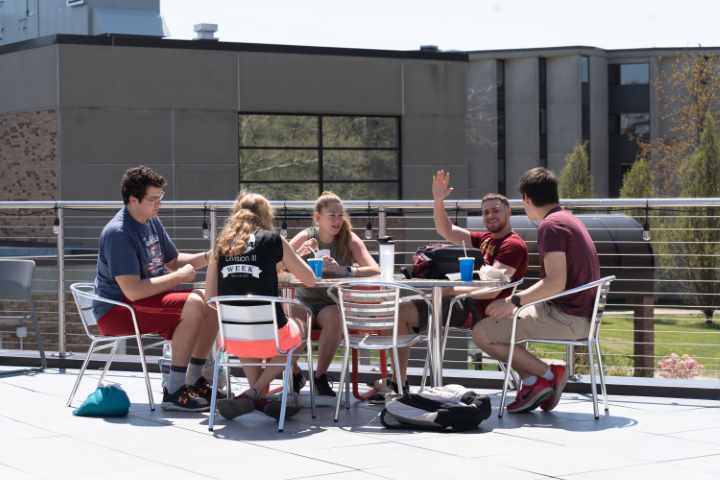 Students sitting by brickyard point